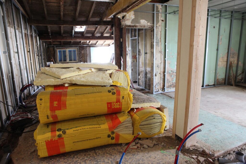 a pile of construction materials sitting on top of a floor